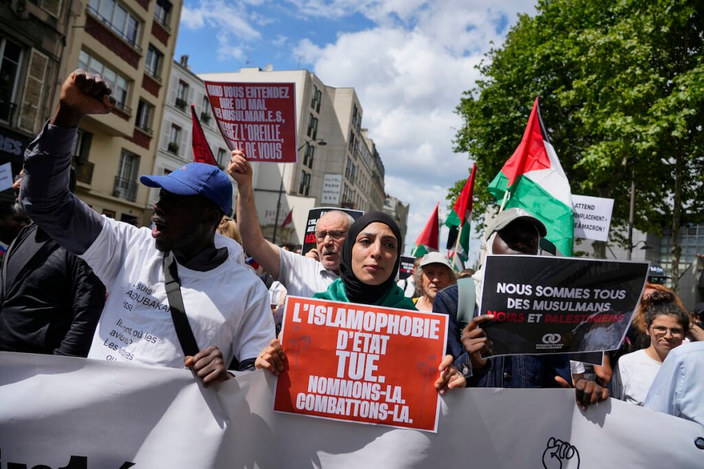 Tangled in conspiracy theories and violence, Muslims prepare for a new Islamophobic law