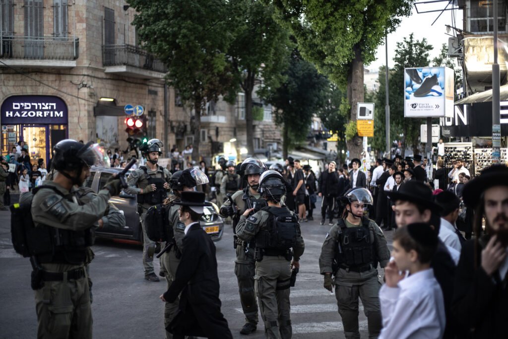 Dozens of ultra-Orthodox Jews block key road near Tel Aviv to protest arrest of draft evader