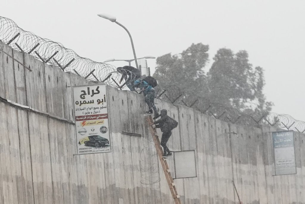 Palestinians risk lives crossing separation wall to reach Jerusalem